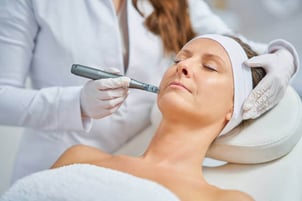 Microneedling treatment to enhance skin repair and improve texture.